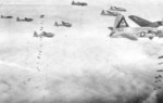 Formation of B-17G Flying Fortress bombers dropping bombs over Europe, circa 1944