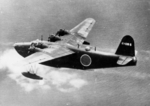 H8K flying boat in the midst of being shot down by the US Navy PB4Y-1 Liberator aircraft of Patrol Squadron VP-115 from which this photograph was taken, 2 Jul 1944. Photo 1 of 2.
