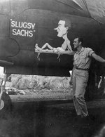 USAAF 3rd Bomb Group airman posing alongside of the nose art of A-20 Havoc aircraft 