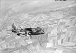 A British DB-7B Boston Mk III bomber of RAF No. 88 Squadron over Dieppe Harbour, France, 19 Aug 1942