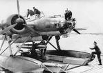 He 115 C4 aircraft loading a LT F 5b practice torpedo, date and location unknown, photo 1 of 2