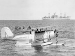 United States Coast Guard J2F-6 Duck aircraft resting in Antarctic waters during Operation Hughjump, 7 Jan 1947; ship in background was either USS Yancey or USS Merrick