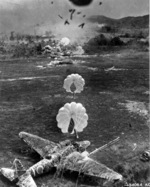 View from an American A-20 Havoc aircraft during a bomber run against a Japanese airfield, 1943-1945; note Ki-21 aircraft about to be destroyed