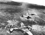 Bomb Damage Assessment photo of destroyed Ki-48 bombers at a Japanese airstrip in northern New Guinea, 1942-1943, photo 1 of 2