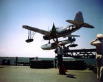 Catapult crew of battleship Missouri launching an OS2U Kingfisher aircraft, circa Aug 1944