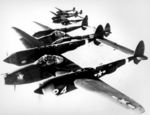 Four P-38 Lightning aircraft flying in formation, Aug 1943-Jan 1947