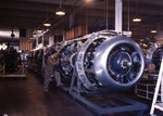 Cowling and control rods being added to engines for B-25 bombers at the North American Aviation plant in Inglewood, California, United States, Oct 1942