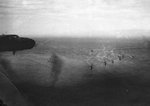 US B-25 bombers flying over transports carrying Australian 9th Division troops, off Lae, Australian New Guinea, 4-6 Sep 1943