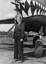 Actress Phyllis Brooks with a B-25 bomber, Dobodura Airfield, Australian Papua, mid-1943