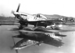 US Air Force F-51 Mustang fighter taxiing through a puddle, Korea, circa early 1950s