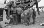 Mechanics working on a P-51D Mustang fighter of Chinese Air Force, Taiwan, 1950s, photo 1 of 4