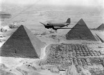 US Air Transport Command C-47 Skytrain aircraft flying over the Giza Necropolis in Egypt, 1943