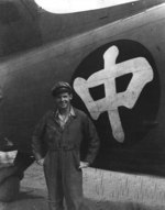 Ethnically-American pilot working for China National Aviation Corporation posing in front of a C-47 Skytrain aircraft, China, circa late 1940s