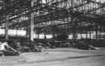 Destroyed aircraft hangar at Omura, Sasebo Naval District, Japan, late 1945; note L2D aircraft in center