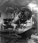 SOC-3 Seagull aircraft stripped for maintenance in the hangar of light cruiser Savannah, 1938; note Pratt and Whitney R-1340 9-cylinder radial engine