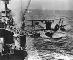 SOC Seagull aircraft just launched from catapult of a New Orleans-class heavy cruiser, circa 1942-1943