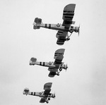 Three Swordfish aircraft, equipped with rockets, performing a training flight from St. Merryn Royal Naval Air Station, United Kingdom, 1 Aug 1944