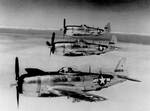 Three P-47 Thunderbolt fighters in flight, circa 1945