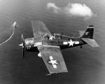 FM-2 Wildcat flying combat air patrol over USS Santee, during the Leyte Invasion, 20 Oct 1944
