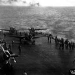 USS Kitkun Bay prepared to launch FM-2 Wildcat fighters during Battle off Samar, 25 Oct 1944; note shell splashes in background
