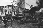 Soviet soldiers moving past a knocked out German tank, Ternopil, Ukraine, 4 Mar 1944