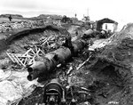 Three Japanese Type A-class midget submarines wrecked by demolition charges, at a former Japanese base on Kiska Island, Aleutian Islands, 7 Sep 1943, photo 1 of 2