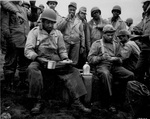 African-American soldiers of the labor battalion deployed by the US Army eating a meal in the field, Massacre Bay, Attu, Aleutian Islands, US Territory of Alaska, 20 May 1943