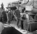 Wounded British troops disembarking at an Egyptian port after being evacuated from Crete, Greece, 31 May 1941