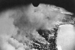 District of Tarumiza at Kagoshima, Kyushu, Japan under attack by aircraft of 499th Bomb Squadron, US 345th Bomb Group, 17 Jun 1945