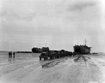 LST-72 and LST-325 unloading directly onto trucks after being left 