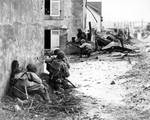 Men of US Army 2nd Infantry Division advancing into Brest, France under German machine gun fire, 9 Sep 1944