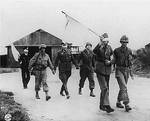 German officer prisoners being led back after talk with Allied officers near Brest, France, Sep 1944