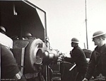 Crew of HMS Ladybird operating a 6-inch 50-caliber Mk XIII gun during the bombardment of Bardia, Libya, 2 Jan 1941