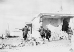 Australian troops rushing through the streets of Bardia, Libya, 4 Jan 1941