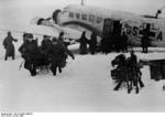 German troops in the Demyansk Pocket unloading supplies from a Ju 52 transport, Russia, Jan 1942