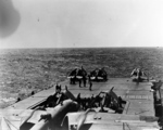B-25 Mitchell bomber and F4F-4 Wildcat fighters on the flight deck of USS Hornet while en route toward Japan, Apr 1942, photo 2 of 2