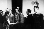 Song Meiling awarding Richard Cole, Henry Potter, Edgar McElroy (shaking hands), Richard Joyce, and Jack Ahren Sims for Doolittle Raid success, Chongqing, China, 29 Jun 1942