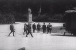 Hitler (hand on hip) looking at statue of F. Foch before meeting with French delegation for negotiation of the armistice document, Compiègne, France, 22 Jun 1940; still from 1943 film 
