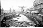 Damaged dock facilities and sunken tug boat at Brest, France, Jun 1940