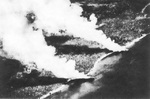 Two beached Japanese transports burning after US aerial attack near Tassafaroga Point, Guadalcanal, 15 Nov 1942