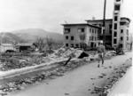 Japanese man walking amidst destroyed Hiroshima, Japan, 1945