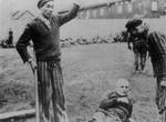 Liberated prisoners killing German guards at Dachau Concentration Camp, Germany, 29 Apr 1945