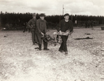 Civilians from Landsberg am Lech, Germany carrying the remains of a Landsberg Concentration Camp prisoner to a burial site, Apr-May 1945