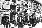Takashi Sakai and Masaichi Niimi leading Japanese troops on a march on Queen