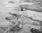 British Hawker Hurricane Mk IIC fighter of No. 42 Squadron RAF, piloted by Flying Officer Campbell, attacking a bridge on the Nambol River near Imphal, India, May 1944