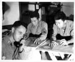 Japanese-American troops of the 522nd Field Artillery, US 442nd Regimental Combat Team working in the fire direction center, Castellina Sector, Italy, 12 Jul 1944