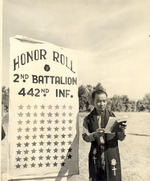Japanese-American Chaplain Hiro Higuchi of 2nd Battalion, US 442nd Regimental Combat Team reading names of 72 fallen soldiers, Cecina area, Italy, 30 Jul 1944