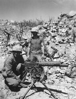A .30 caliber Browning water-cooled machine gun and its crew on Iwo Jima, circa Feb-Mar 1945