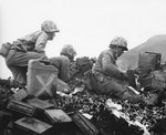 Men of the US 5th Marines Division manning a machine gun, Iwo Jima, Japan, 22 Feb 1945