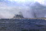 Dense smoke shrouded Mount Suribachi as LVTs left the beaches during the initial day of landings, Iwo Jima, 19 Feb 1945